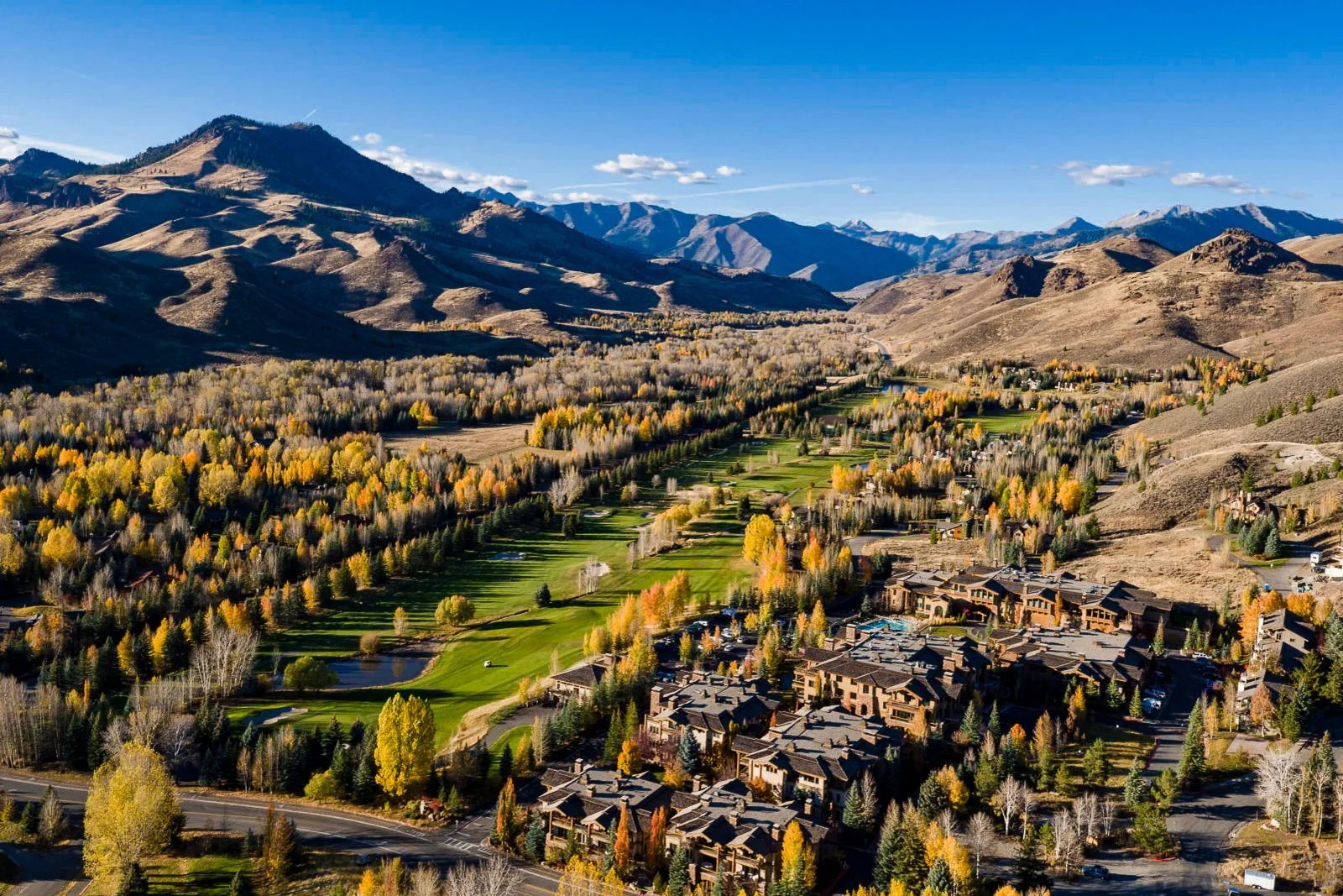 Aerial view of Bigwood Golf Course in autumn, framed by the Boulder Mountains